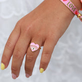 Bague en or mauvais œil coeur rose